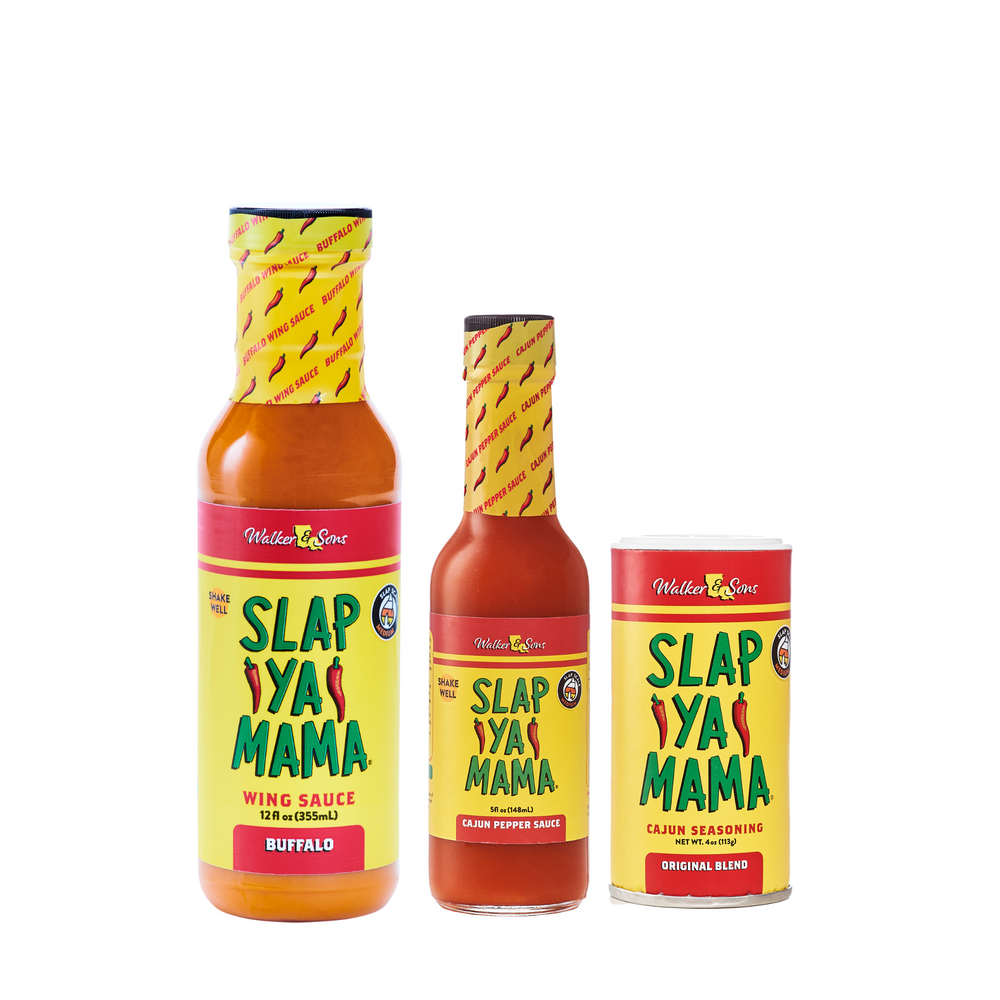 Little Slap Set featuring a bottle of Slap Ya Mama Wing Sauce, a 5oz bottle of Slap Ya Mama Cajun Pepper Sauce, and a 4oz canister of Slap Ya Mama Original Blend Seasoning, arranged together on a white background.