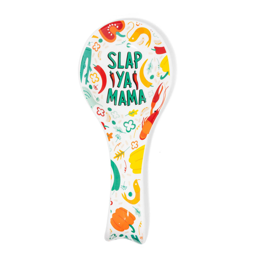 Slap Ya Mama white spoon rest with a green logo, featuring illustrated beignets and crawfish, displayed on a clean white background.