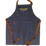 Blue denim apron with the yellow kiss Ya Mama logo embroidered on the chest, with the text 'Louisiana Food Products' in white underneath, and a pepper graphic below that.