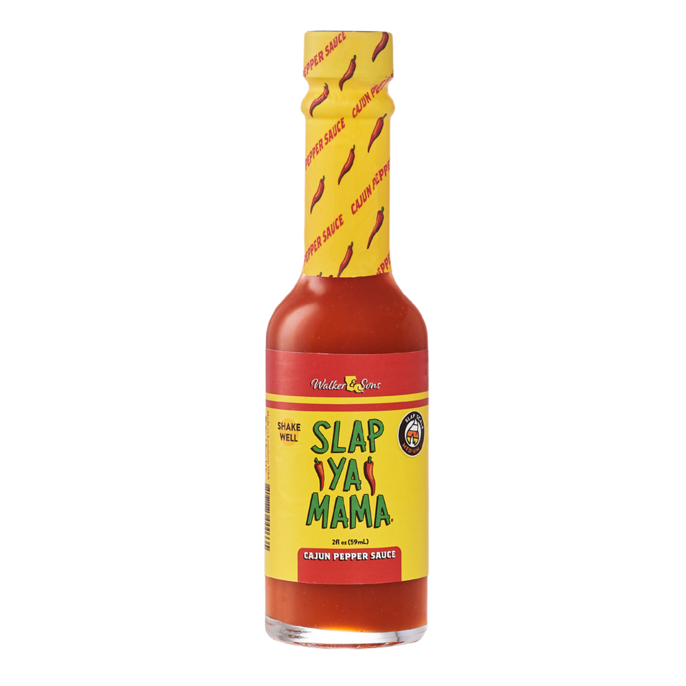 
                  
                    Load image into Gallery viewer, 2 oz Slap Ya Mama Cajun Pepper Sauce bottle with a yellow label, featuring the green and red Slap Ya Mama logo and text reading &amp;#39;Cajun Pepper Sauce&amp;#39; underneath the logo.
                  
                