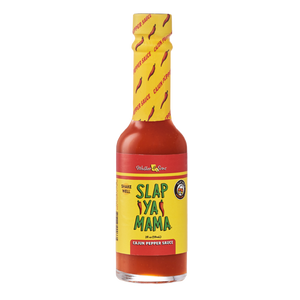 
                  
                    Load image into Gallery viewer, 2 oz Slap Ya Mama Cajun Pepper Sauce bottle with a yellow label, featuring the green and red Slap Ya Mama logo and text reading &amp;#39;Cajun Pepper Sauce&amp;#39; underneath the logo.
                  
                