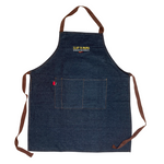 Black denim apron with the yellow Slap Ya Mama logo embroidered on the chest, with the text 'Louisiana Food Products' in white underneath, and a pepper graphic below that.