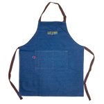 Blue denim apron with the yellow Slap Ya Mama logo embroidered on the chest, with the text 'Louisiana Food Products' in white underneath, and a pepper graphic below that.