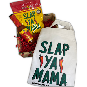 
                  
                    Load image into Gallery viewer, Slap Ya Mama White Cook&amp;#39;s Apron, 1 lb bag of Slap Ya Mama Seafood Boil, and 5oz Cajun Hot Sauce, all unwrapped and placed in a basket decorated with peppers.
                  
                