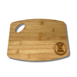 Small bamboo cutting board with the Slap Ya Mama logo engraved in the bottom right corner, displayed on a white background