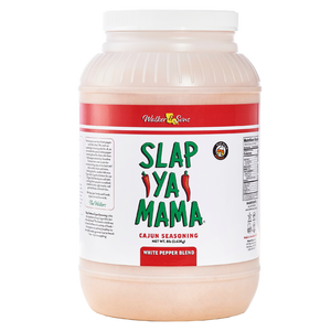 Slap Ya Mama White Pepper Blend gallon container with a white label, green logo, and red accents on the label.